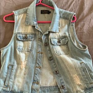 Distressed denim vest